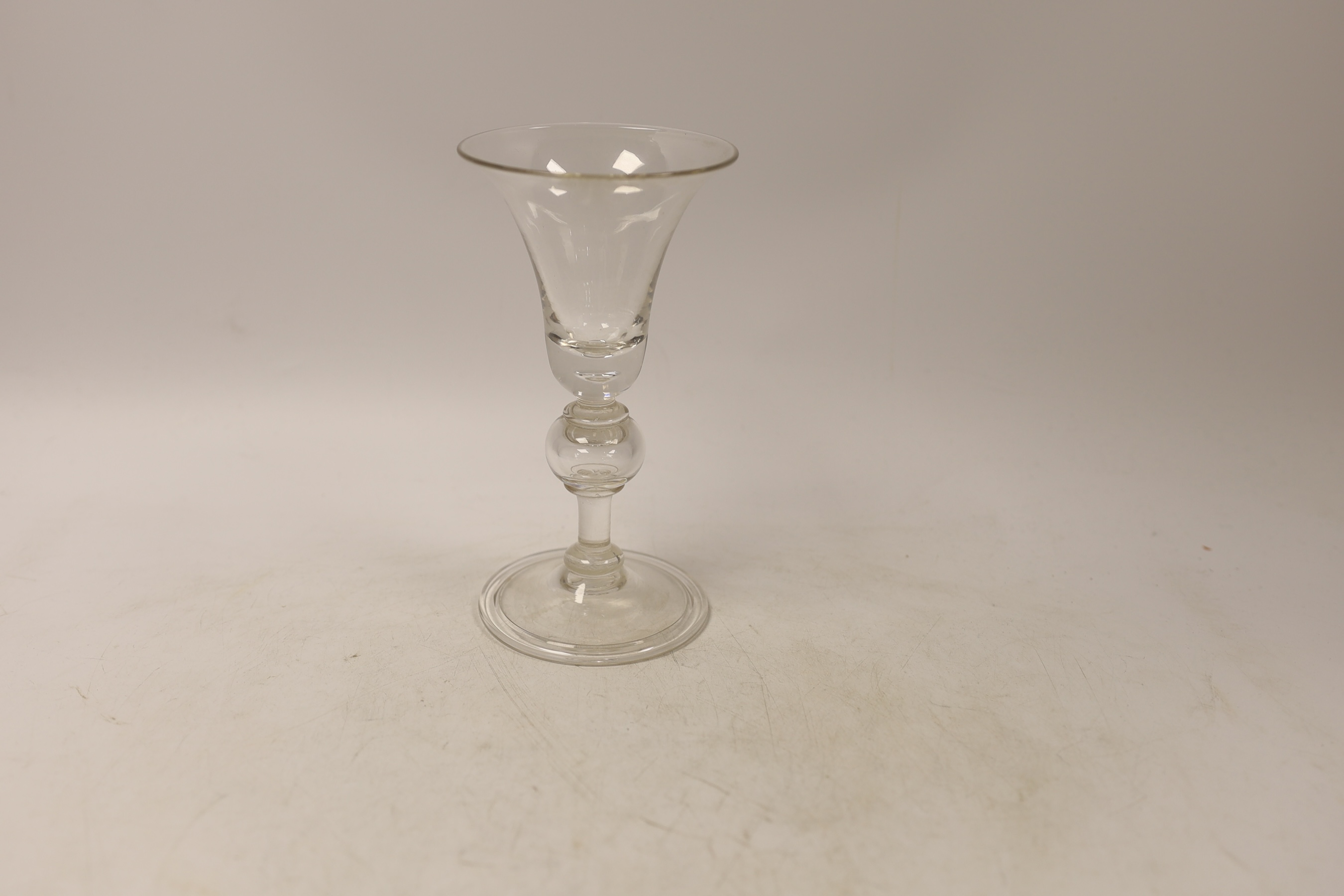 A reproduction wine glass with trumpet shaped bowl, folded foot and single knop, 17cm